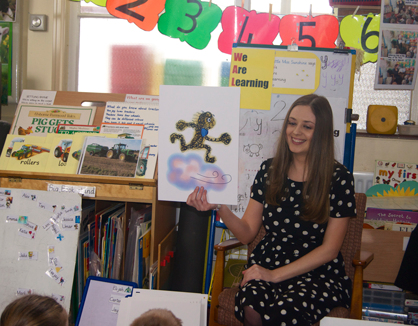 Fiona reading to school children